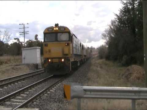 Pacific National 8154 works 8138N with 8127 leaving orange from manildra