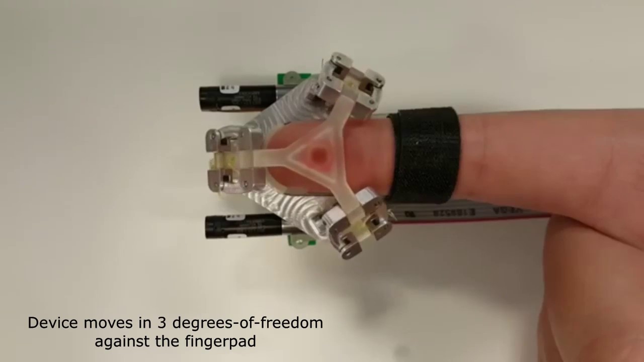 Fingertip tactile devices for virtual object manipulation and exploration