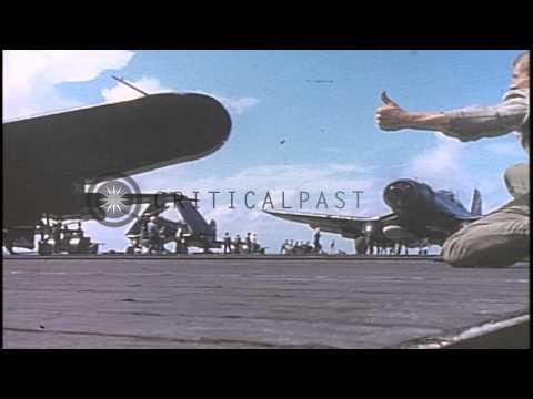 Damaged TBM Avenger jettisoned from US Aircraft Carrier deck into Pacific Ocean a...HD Stock Footage