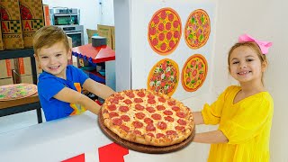 Trẻ học cách nấu pizza và giúp đỡ lẫn nhau
