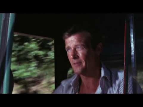 Bond behind the wheel of a double-decker bus