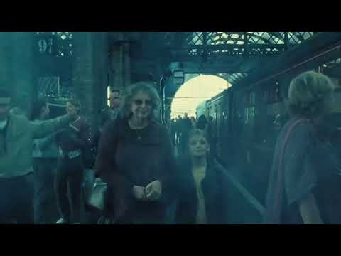 Ministry of Magic atrium duel mood from trailer frame, blue light and glass