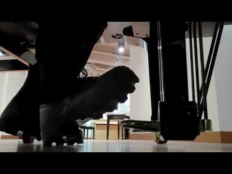 Piano pedal pumping in black boots