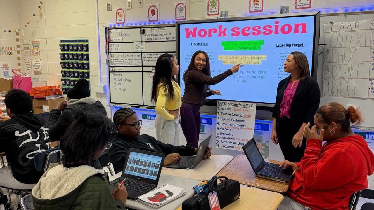 Hope interrupts the class and the teacher makes her come up and teach the class 