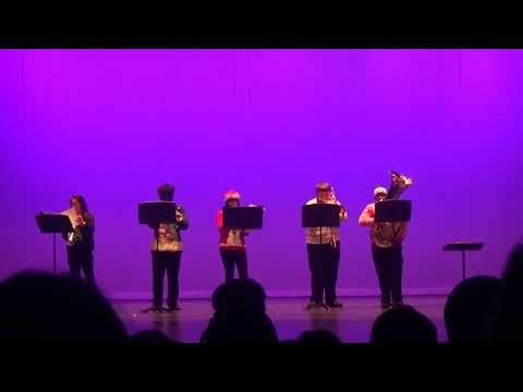 This High School Brass Band Is Playing "Sleigh Ride" But Watch The Percussionist