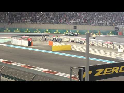 Lewis Hamilton celebration burnout wheel spin and Union Jack flag F1 Abu Dhabi Grand Prix 2014