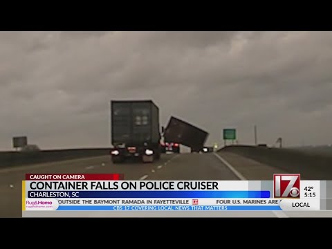 Container falls off truck, lands on Charleston police cruiser