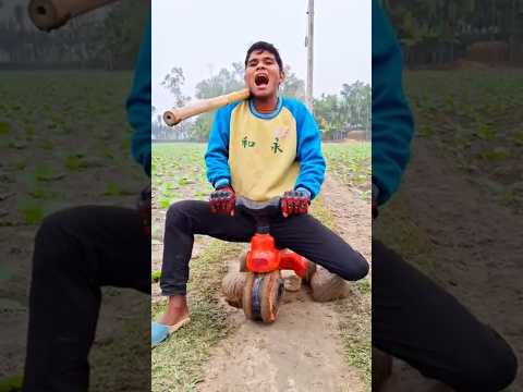 A little boy is having fun with his bicycle.