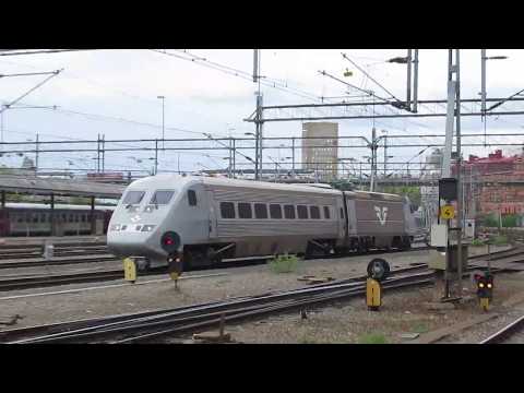 Thumbnail for Sweden: Stockholm Central, X2000 power car and 1 coach passing by Kalmar Verkstad