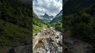 “A massive construction site hidden deep in the mountains. 🏔️🏗️ Would 