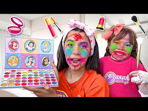 Sarah and Eloah pretend to play with makeup toys for children