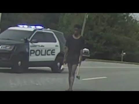 Police disarm man carrying ax with shotgun loaded with bean bag