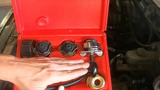Pressure testing a engine cooling system and radiator cap.