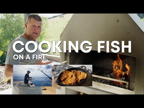 Cooking fish on an outdoor fireplace