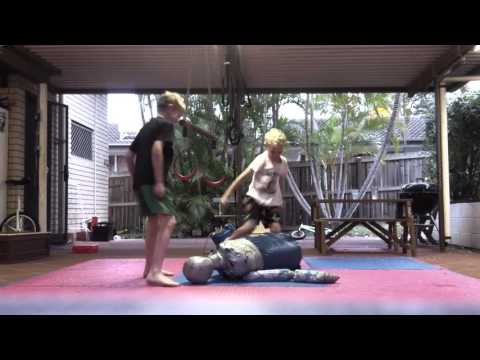 Two Boys and a Grappling Dummy