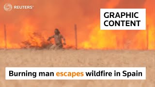 WARNING: GRAPHIC CONTENT - Burning man escapes wildfire in Spain