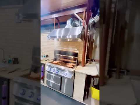 Twin Eagles 42" Gas Grill on Cart Covered Patio Custom Outdoor Kitchen Installation with Vent Hood
