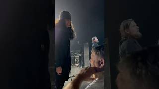 Ian Astbury puts a tambourine over a fans head #thecult May 20 2023