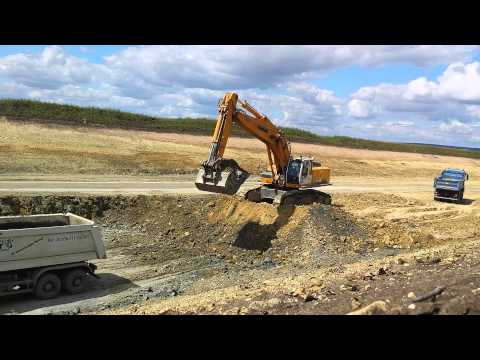 Liebherr R964C loading MB Actros dump trucks