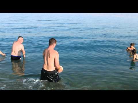 Floating with a rock in the Dead Sea