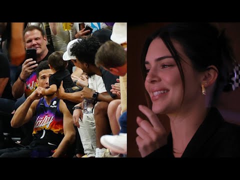 Kendall Jenner watching Devin Booker fist pump a baby