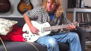 BluesBeaten Redshaw tunes up his new Plasti-Kraft guitar, Rag boy, Rag!