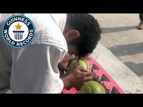 Most green coconuts smashed with the head in one minute - Guinness World Records