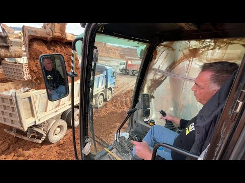 Caterpillar 365C Excavator Loading Mercedes And MAN Trucks - Operator View