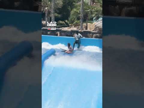 Surf Pool Attendant Is Prepared For Woman's Wipeout