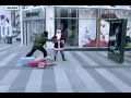 Video 'Mad Santa, spin kicks guy in face! '