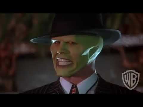 The Mask trailer frame of Jim Carrey as the Mask dancing in yellow zoot suit on Coco Bongo dance floor