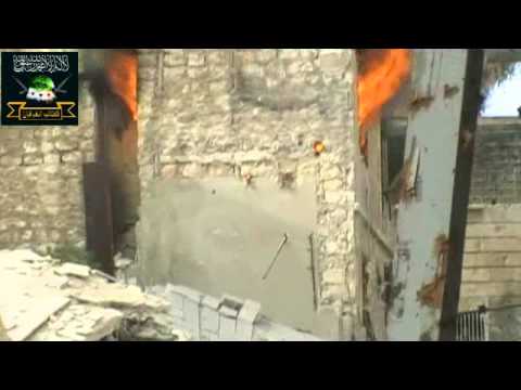 إحراق المبنى الذي يتواجد فيه قناص النظام ضمن معارك تحرير حي الجديدة