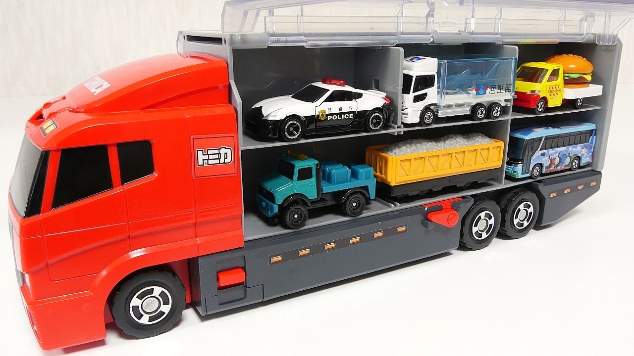トミカのミニカーが走る！はたらく車を開封してレッドコンボイに収納しよう☆