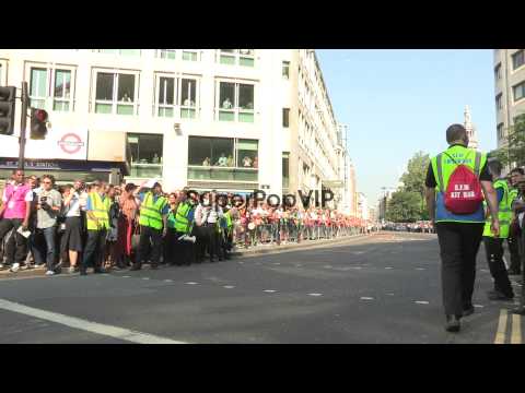 The torch leaves St Paul's Cathedral to a backdrop of cit...