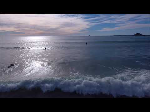 Aerial footage of South Beach and surfers