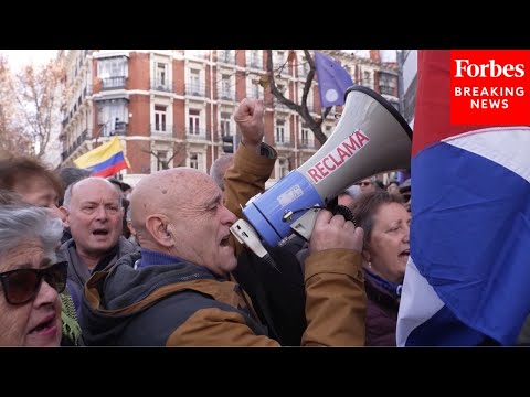 Protesters Gather En Masse In Spain After U.S. Military Actions Against Venezuela