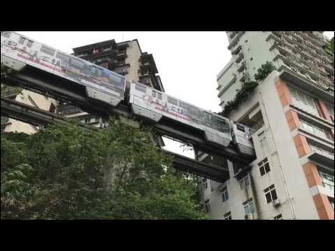Monorail train passes THROUGH residential building in China's Chongqing!