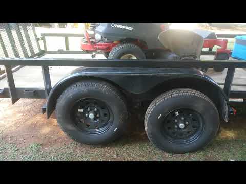 Carry-On Trailer out of line back tires off the ground front on the ground.