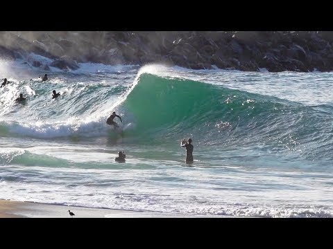 Professional Skimboarders charging shallow slabs at The WEDGE