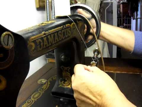 Loading thread on long bobbin of a Damascus sewing machine