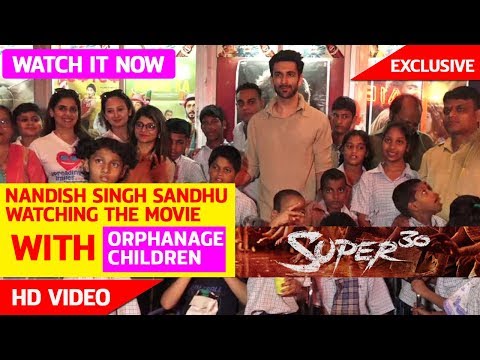 NANDISH SINGH SANDHU WATCHING THE FILM WITH ORPHANAGE CHILDREN