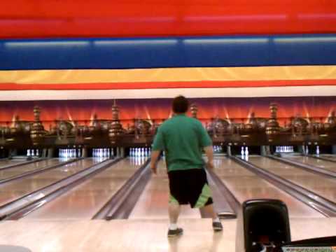 Guy falls while bowling.