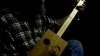 Seasick Steve playing a home-made 1 string Diddley Bow