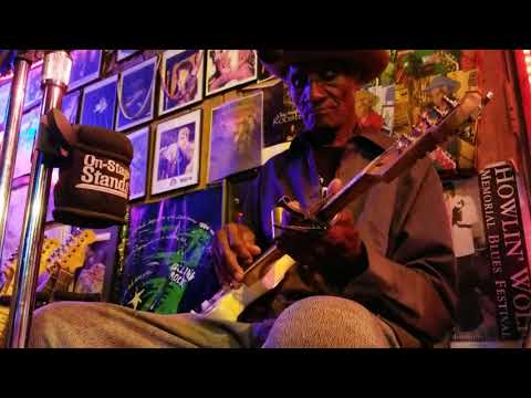 Mr. Gip playing guitar