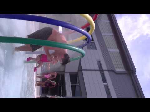 2011.06.19-Daddy walks Mackenzie through the spray tunnel