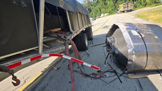 Giant steel coil explodes thru the side of a semi truck and  onto highway.