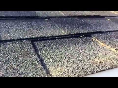 DIY rain gutter install on lake cottage