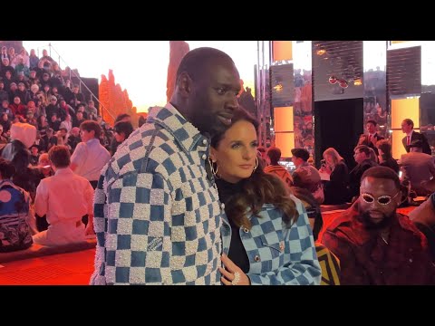 OMAR SY AND HIS WIFE HÉLÈNE SY AT LOUIS VUITTON MEN'S FALL WINTER 2024 SHOW IN PARIS