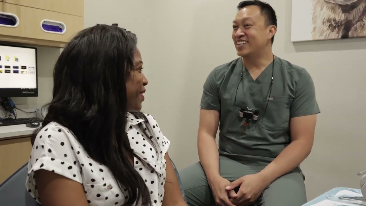 Dallas dentist talking with a patient in the dental chair