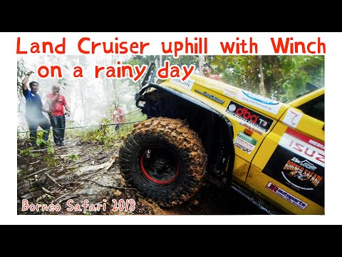 Toyota Land Cruiser uphill with Winch on a rainy day - Borneo Safari 2018